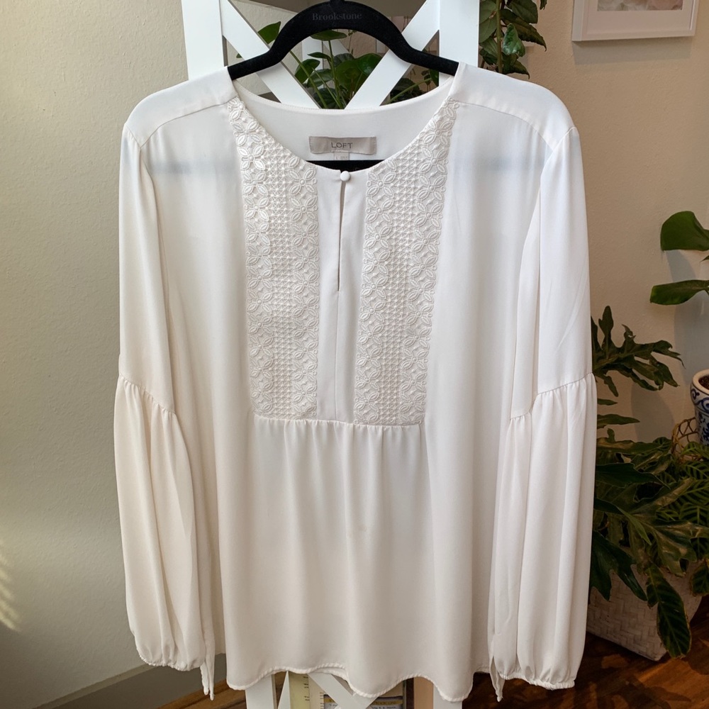 Cream blouse with lace details and bell sleeve